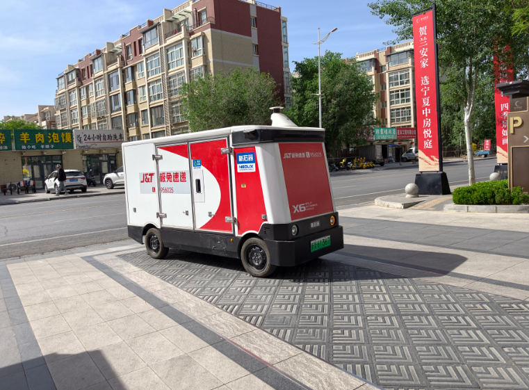 “无人驾驶快递必赢网址车”落地贺兰(图1)